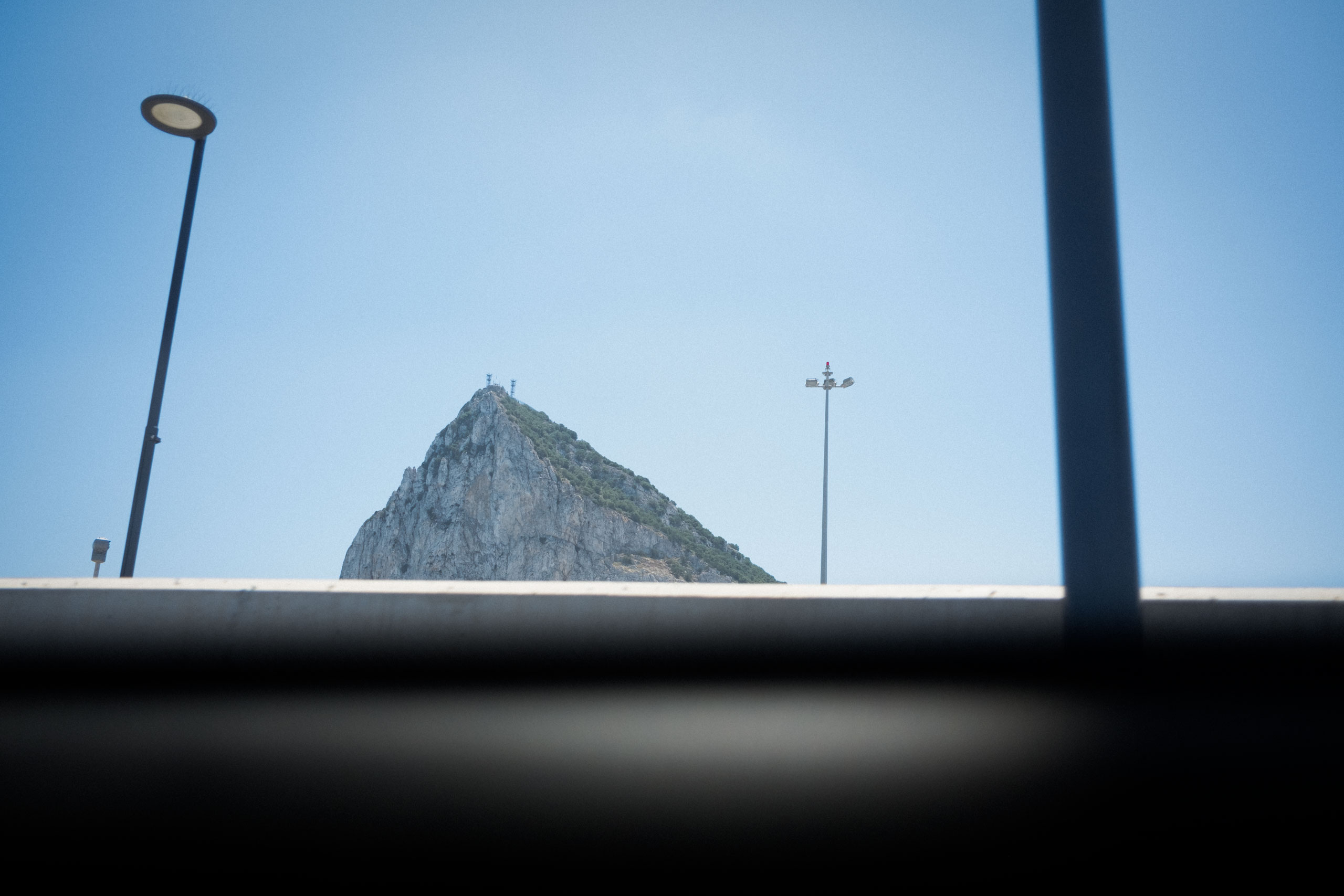 A view of Gibraltar glimpsed through the window of a bus.
